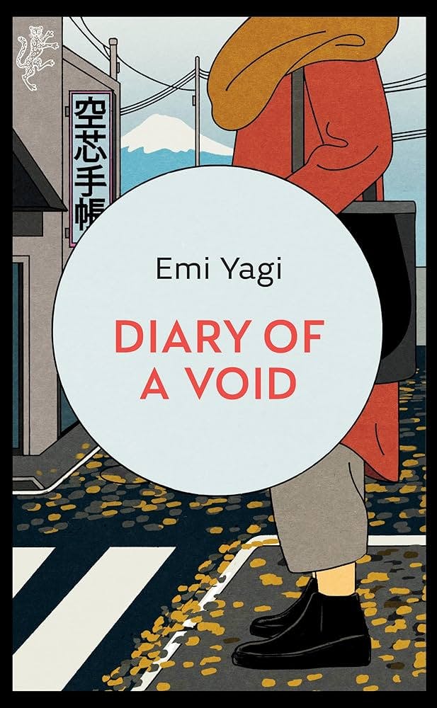 Diary of a Void by Emi Yago cover which features a light blue circle for the text on top of a drawing of the lower body of a woman from neck down wearing a yellow scarf, orange longsleeve, olive slacks, and black shoes waiting to cross a street with scattered yellow leaves near her and a building in the distance with a Japanese sign